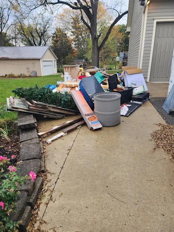 Dumpster being loaded with debris for Commercial Dumpster Rental in Hinsdale